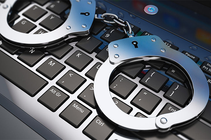 Handcuffs over keyboard