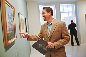 Frank Sancho enjoys Beyond Borders art exhibit at the Freedom Tower.