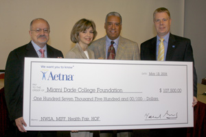 Check being given to Miami Dade College