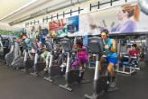 MDC students exercising while using the cardio equipment