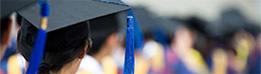 Over-the-shoulder shot of graduate wearing graduation cap