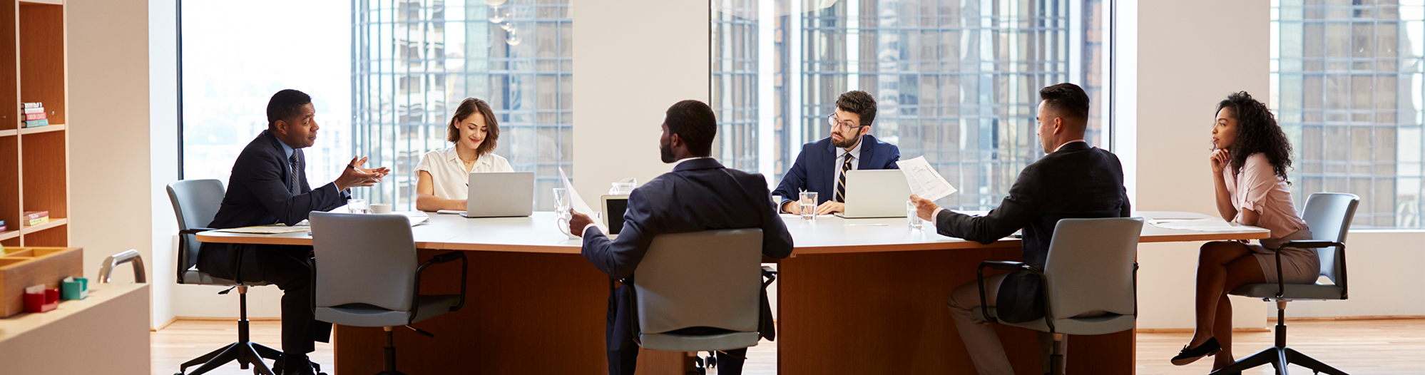 A group of professional sitting in a meeting room