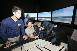 Group of students in the aviation simulation control room