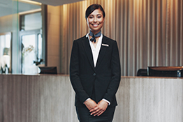 Woman ready to greet customers at hotel