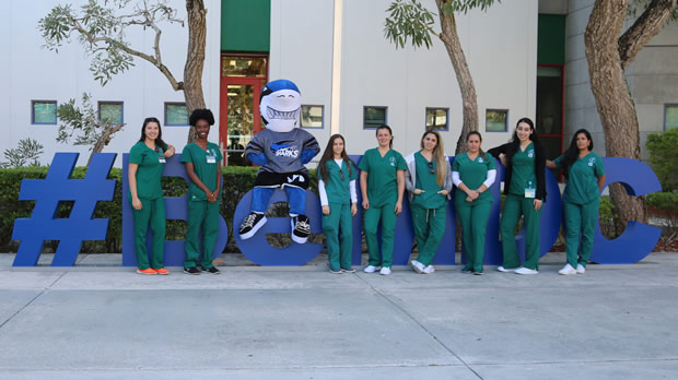 Group of nursing students pose for a picture with Finn the Shark