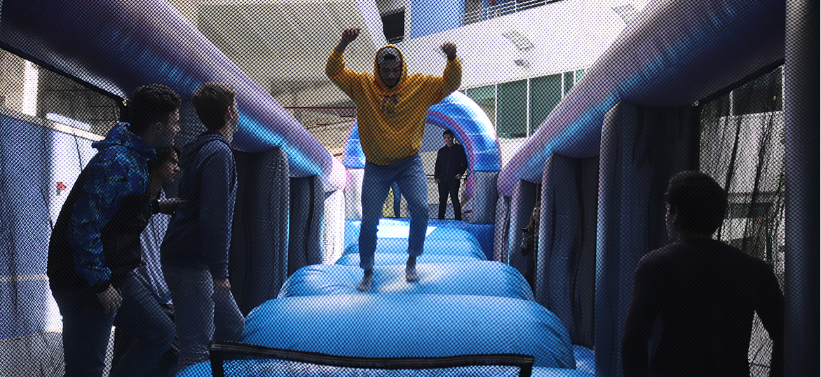 Students having fun in a bounce house