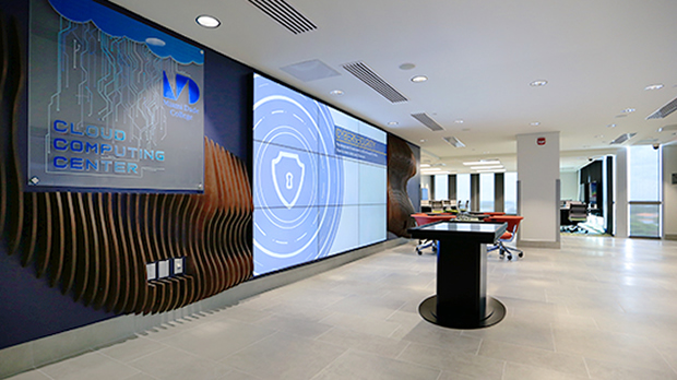 Entryway to the Cloud Computing Center showing large screens and welcome area.