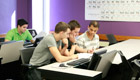 Three male students studying