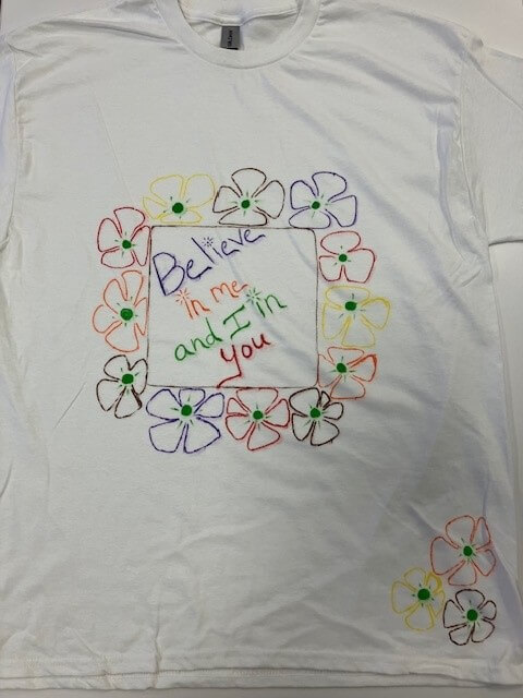 white tee shirt with the words 'believe in me and I in you' hand painted on it