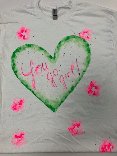 white tee shirt with the words 'you go girl!' hand painted on it
