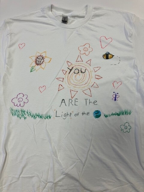 white tee shirt with the words 'you are the light of the world' hand painted on it