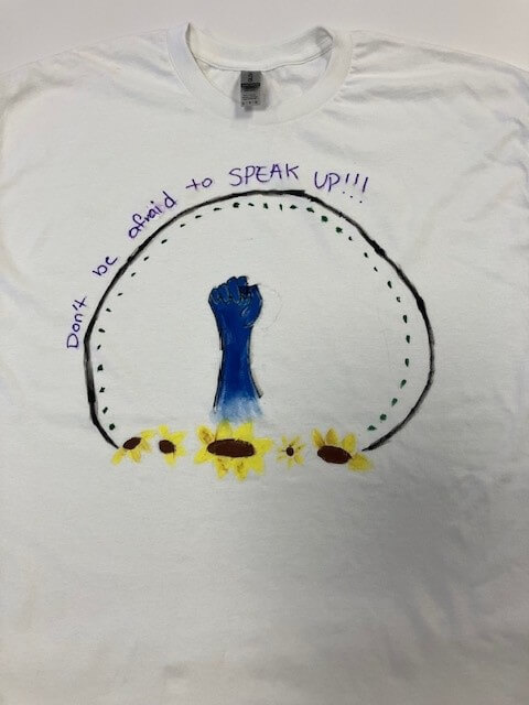 white tee shirt with the words 'don't be afraid to speak up!!!' hand painted on it